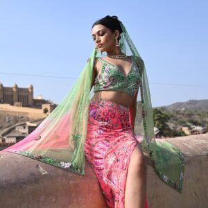 Mehendi Sangeet Special. Features a vibrant green lehenga and a pink top adorned with intricate floral designs.